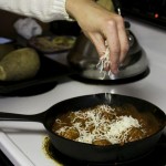 Once marinara sauce is warmed, add meatballs back and allow to coat. Top with mozzarella cheese